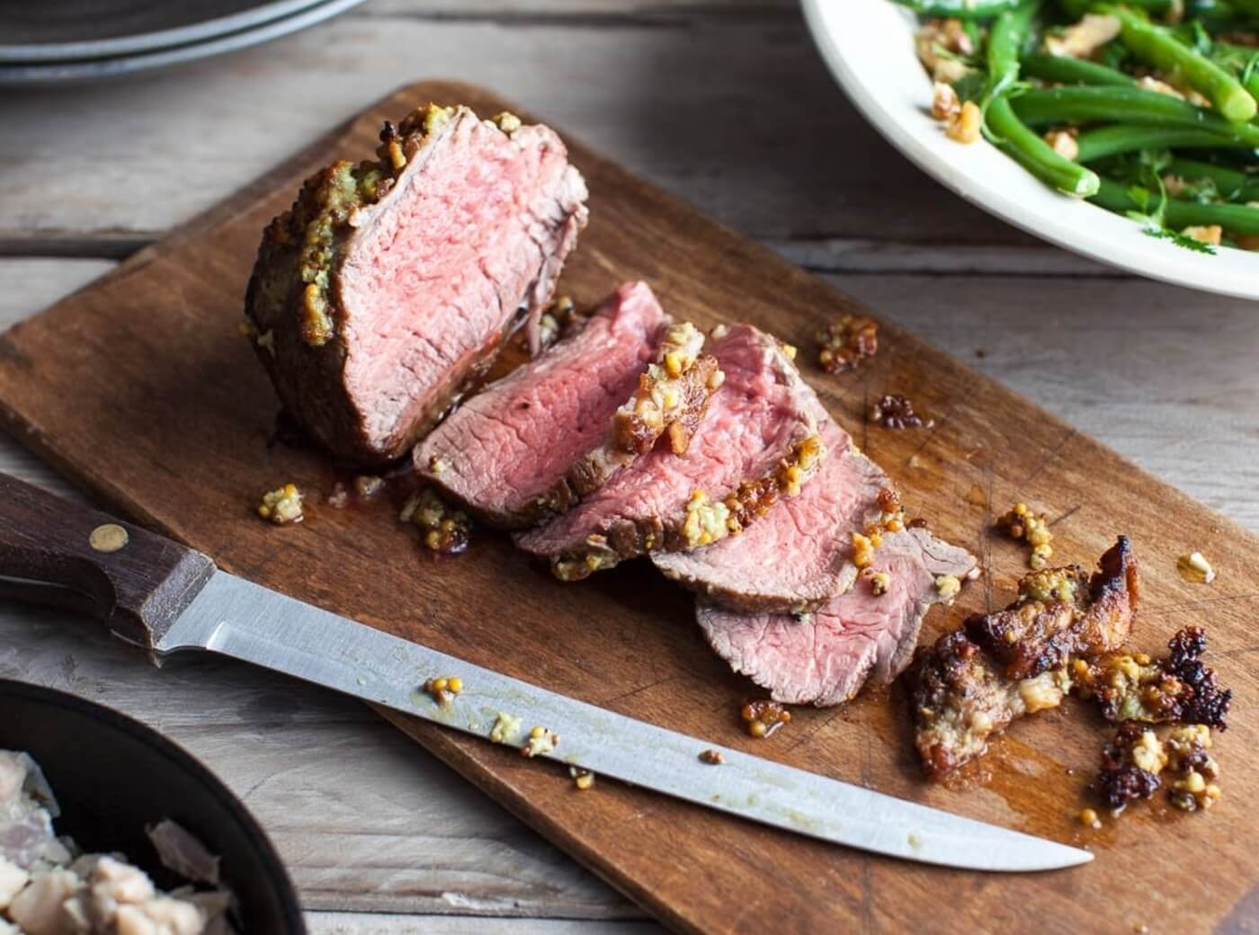mustard-crusted-roast-beef-with-white-bean-mash-and-walnut-dressed-beans-1400x1040-ecc85ccb6198391883e4ce2cc2ffccef